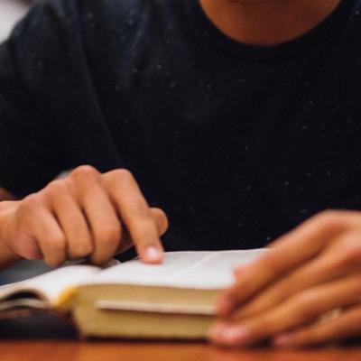 hand held over book