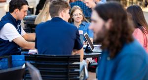 A group of students chatting at a table 